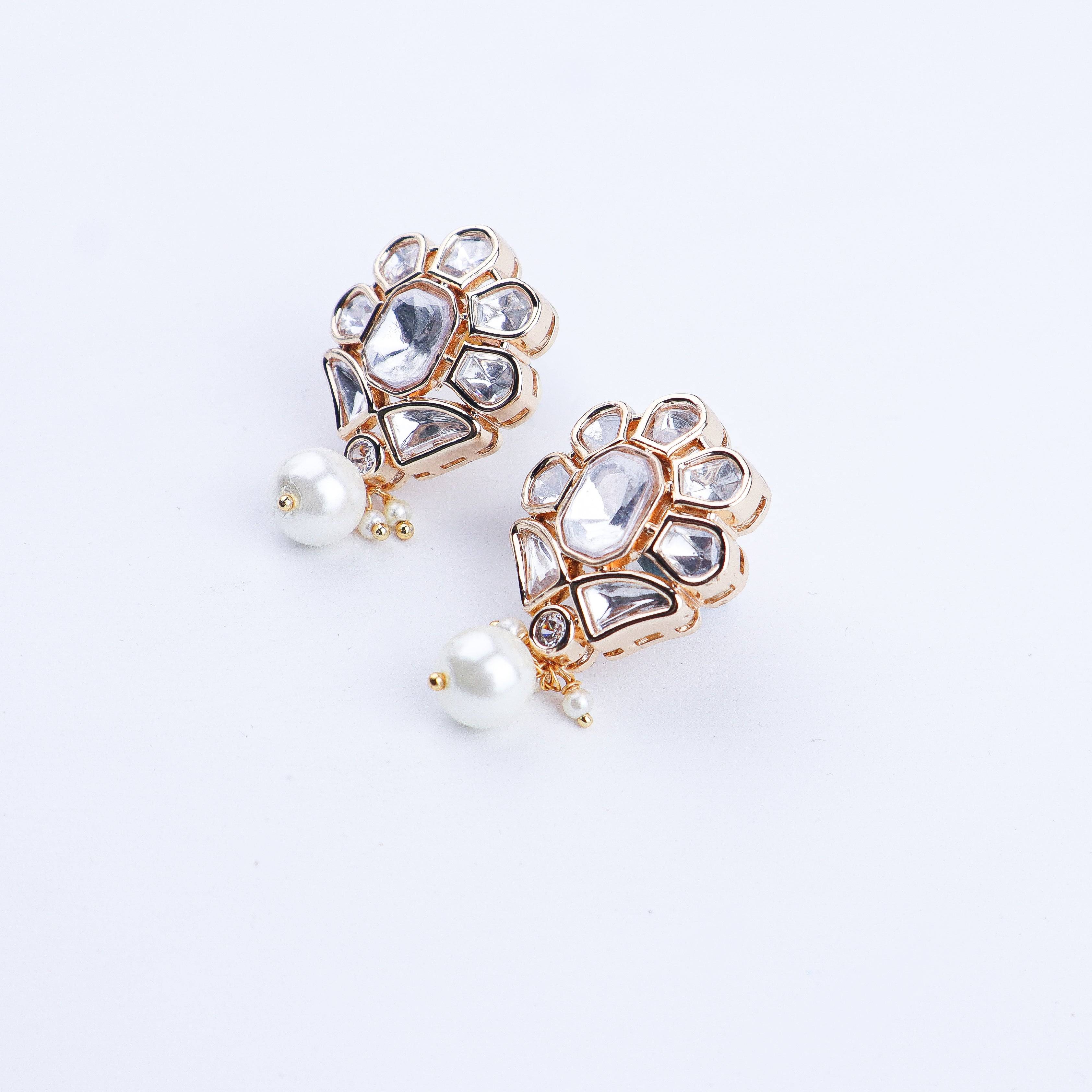 Angled view of a 22K gold-plated fashion earring highlighting its elegant silhouette, structure, and polished gold finish