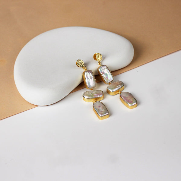 Angled view of 22K gold-plated fashion earring highlighting its elegant silhouette, unique structure, and polished gold finish