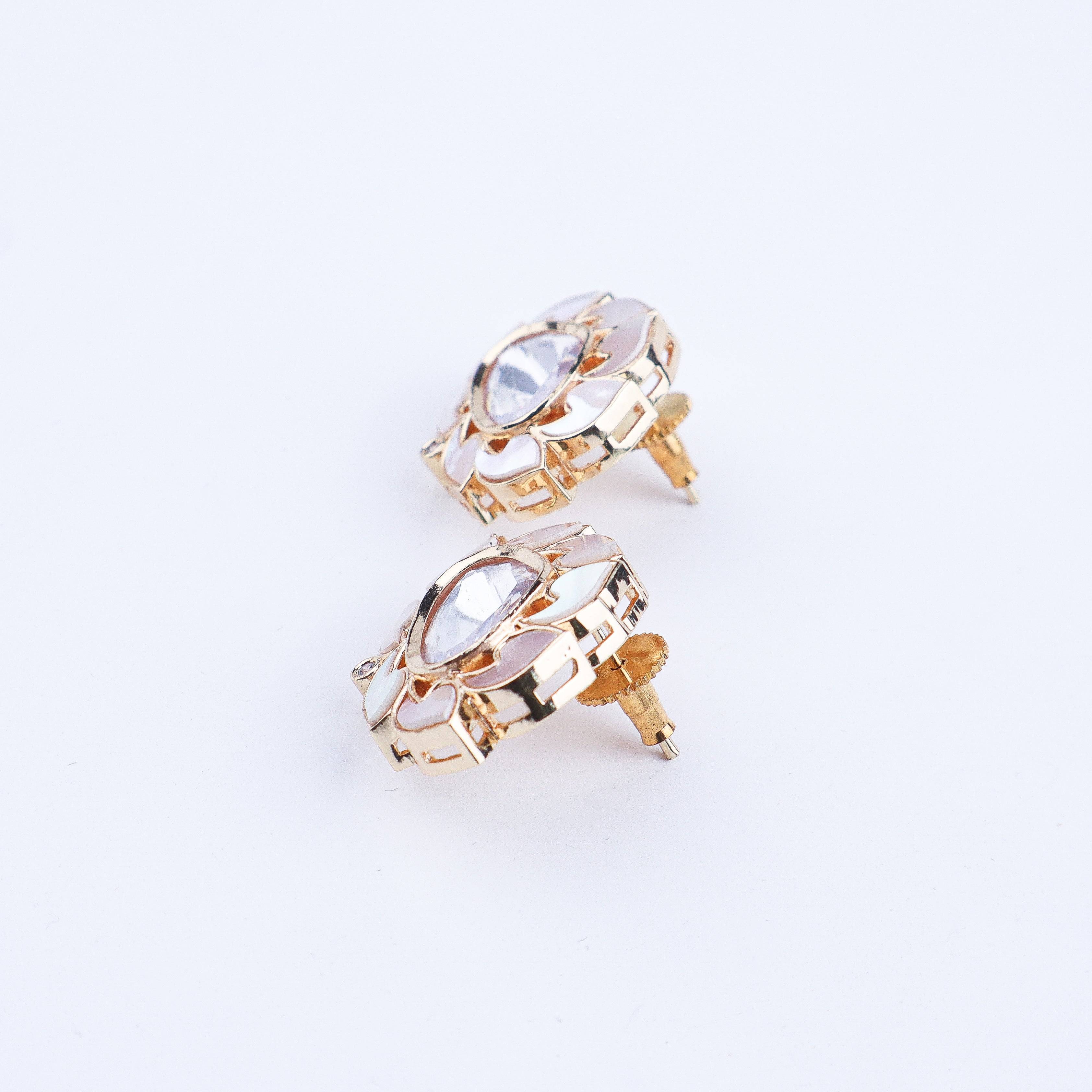Angled view of a 22K gold-plated fashion earring highlighting its elegant silhouette, structure, and polished gold finish