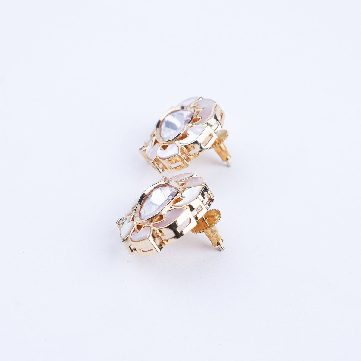 Angled view of a 22K gold-plated fashion earring highlighting its elegant silhouette, structure, and polished gold finish