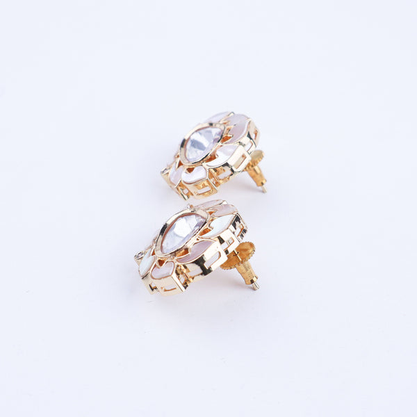 Angled view of a 22K gold-plated fashion earring highlighting its elegant silhouette, structure, and polished gold finish