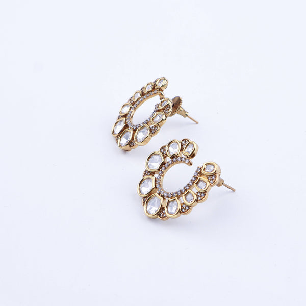 Angled view of a 22K gold-plated fashion earring highlighting its elegant silhouette, structure, and polished gold finish
