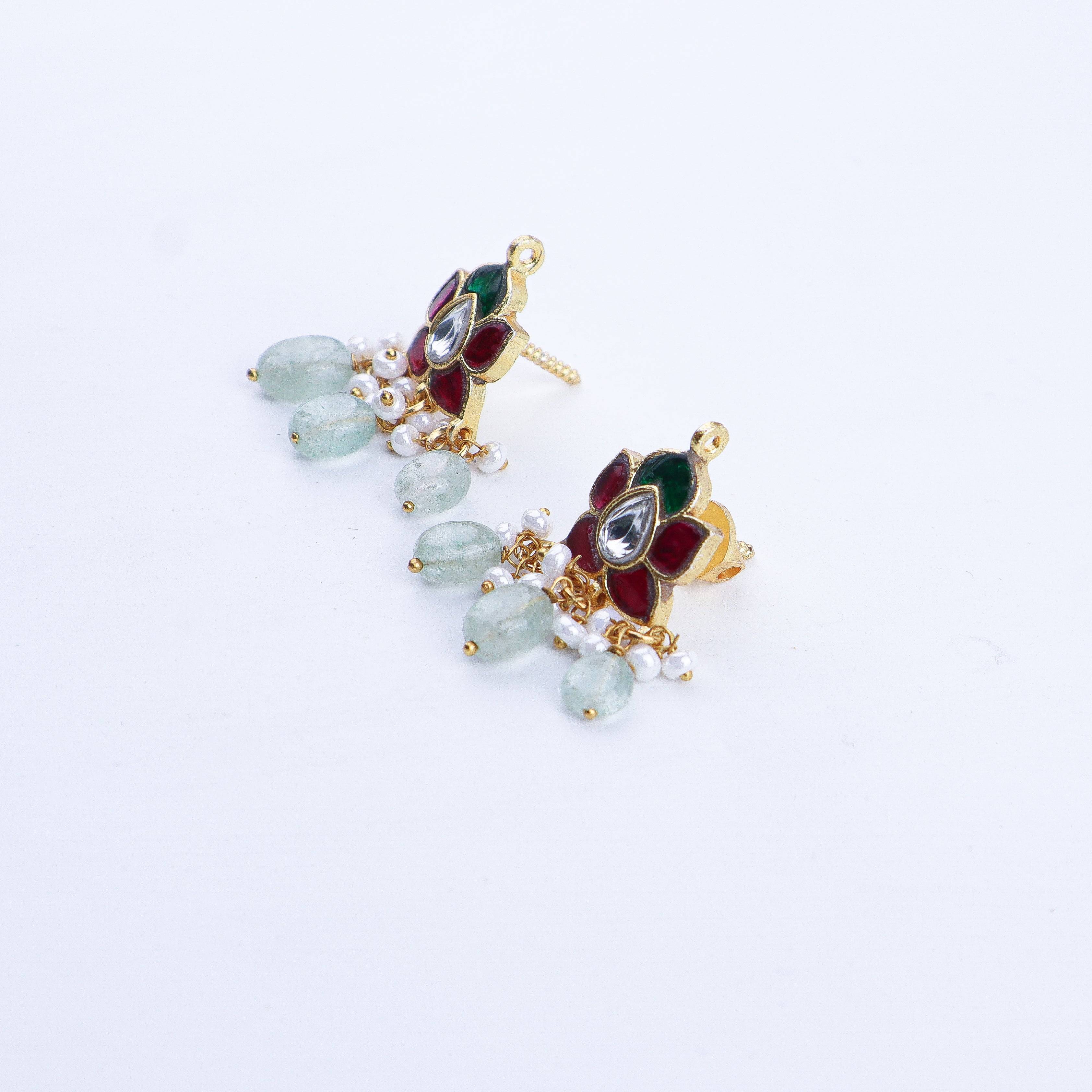 Angled view of a 22K gold-plated fashion earring highlighting its elegant silhouette, structure, and polished gold finish