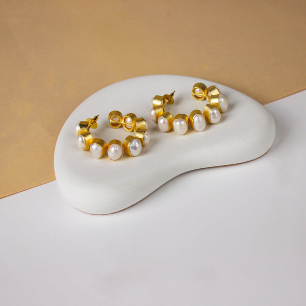 Detailed view of a 22K gold-plated fashion earring highlighting intricate motifs, textured detailing, and a premium 22K gold-plated finish