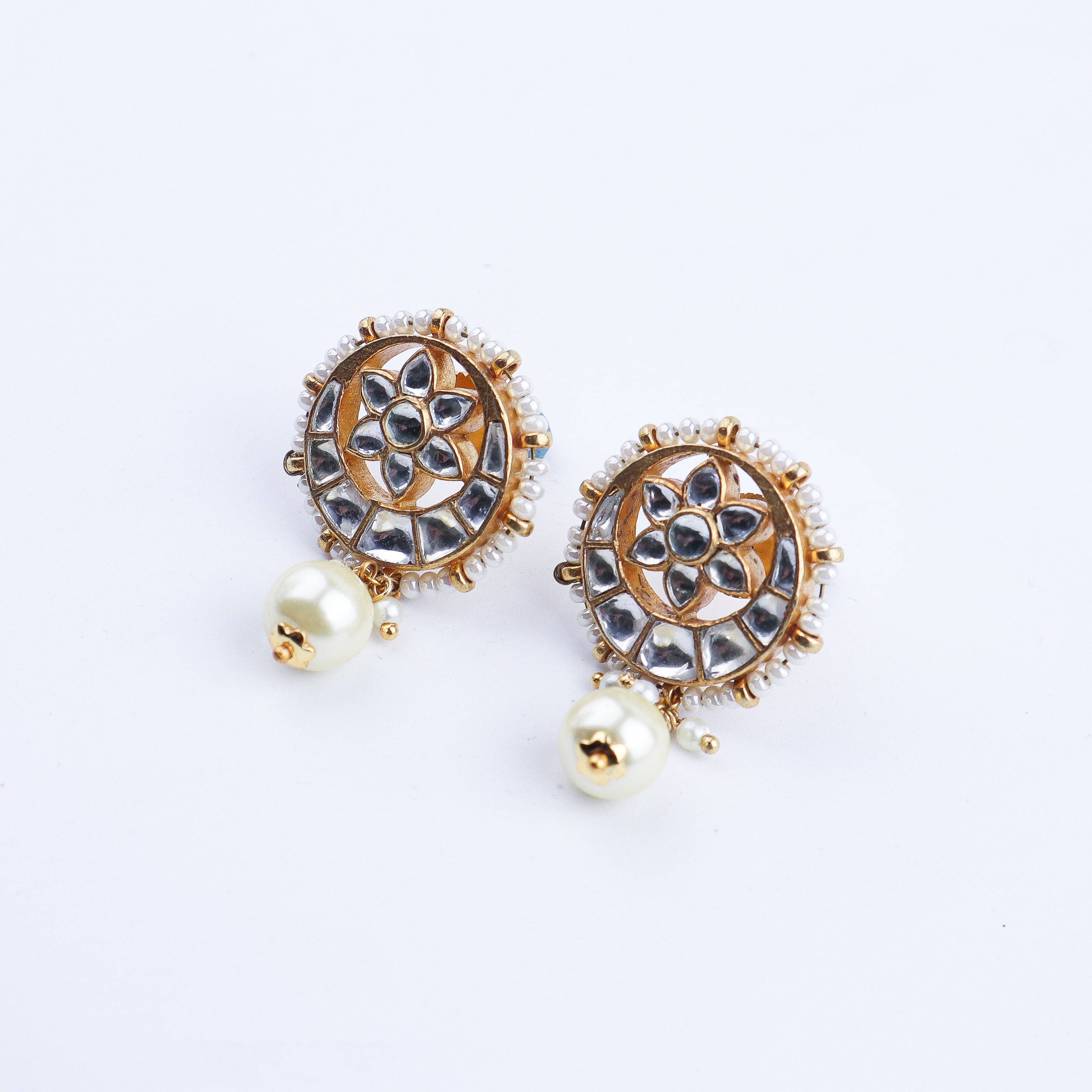 Angled view of a 22K gold-plated fashion earring highlighting its elegant silhouette, structure, and polished gold finish
