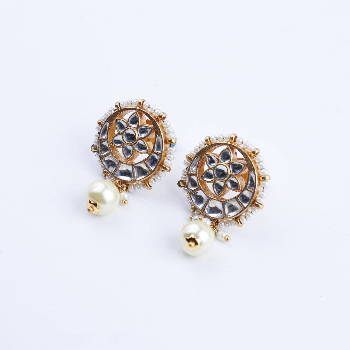 Angled view of a 22K gold-plated fashion earring highlighting its elegant silhouette, structure, and polished gold finish