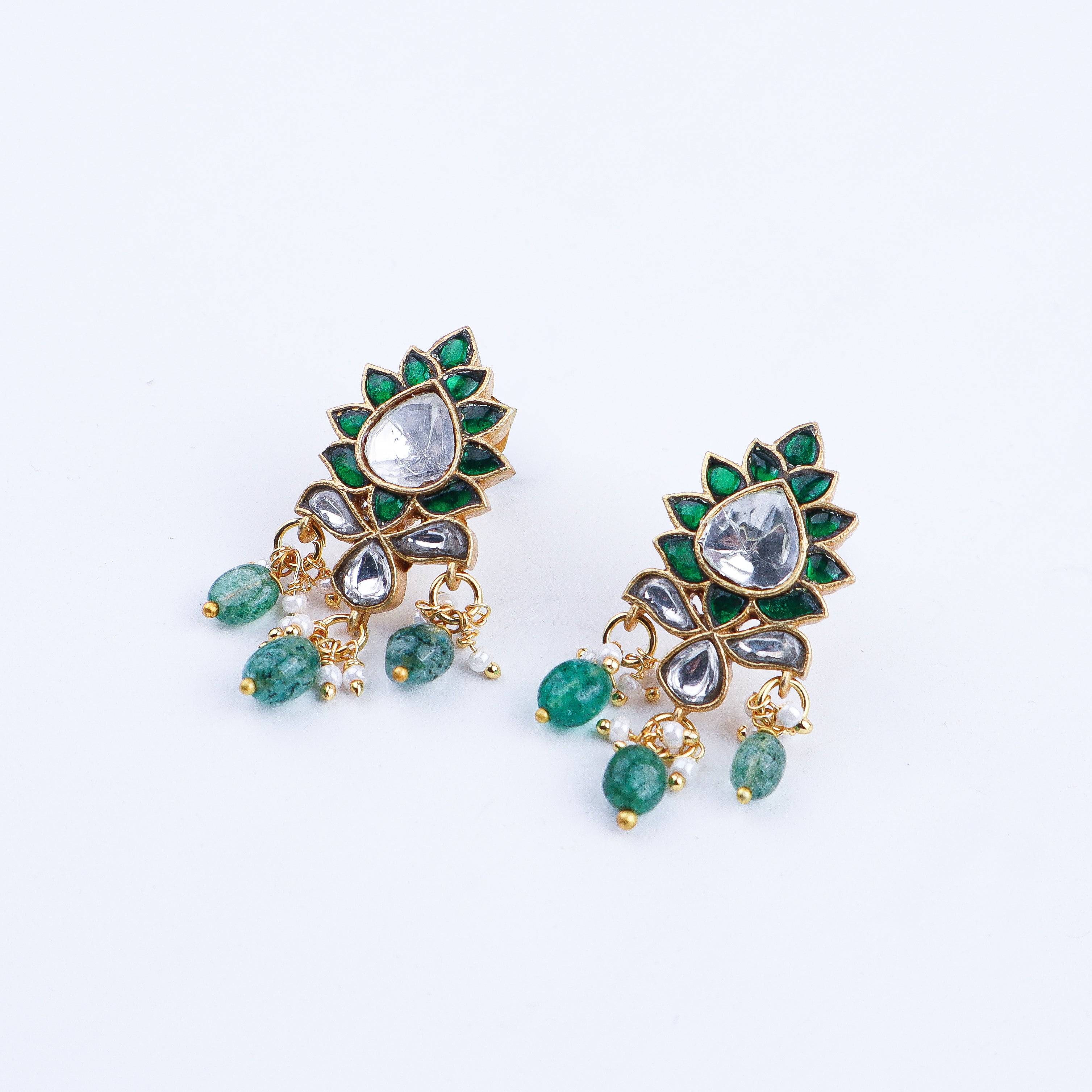 Angled view of a 22K gold-plated fashion earring highlighting its elegant silhouette, structure, and polished gold finish