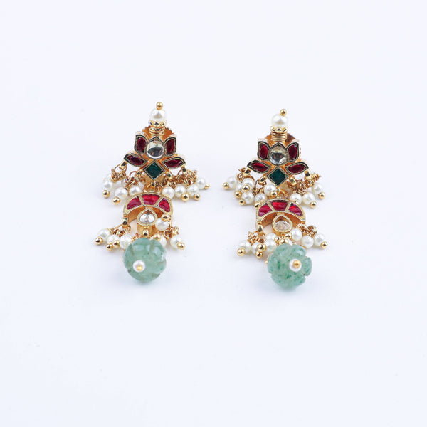 Flat-lay of 22K gold-plated fashion earrings with complementary gold-plated jewelry and elegant accessories