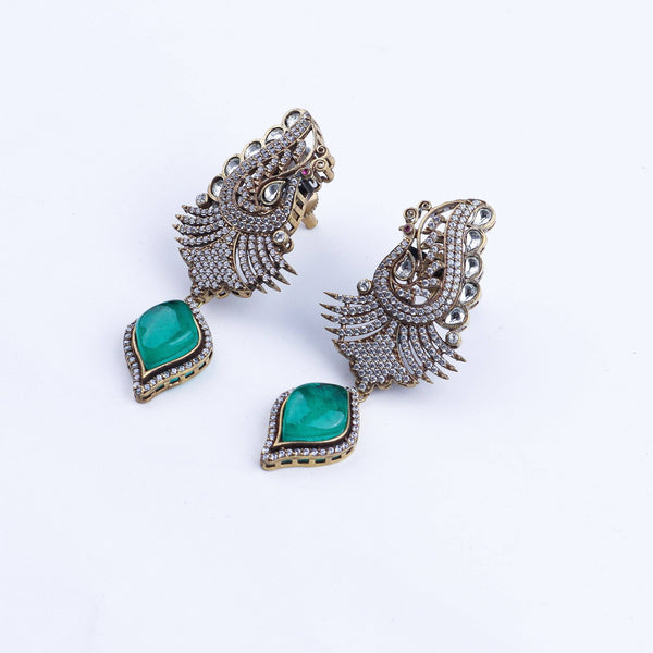 Angled view of a 22K gold-plated fashion earring highlighting its elegant silhouette, structure, and polished gold finish
