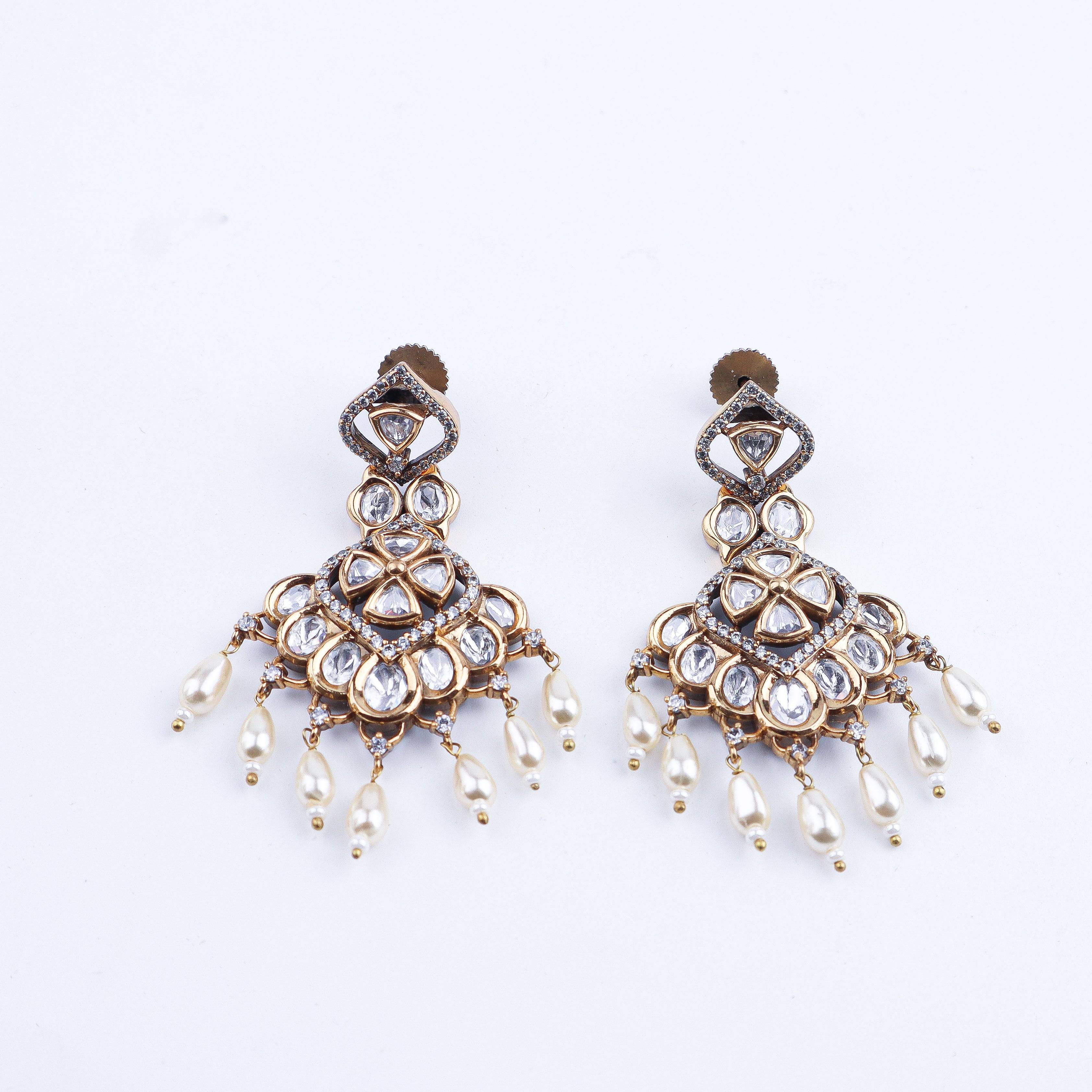 Detailed view of a 22K gold-plated fashion earring highlighting intricate motifs, textured detailing, and premium 22K gold-plated finish