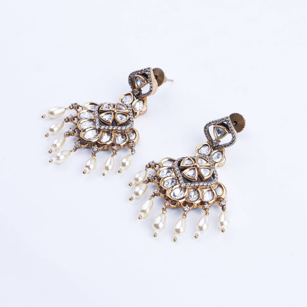 Angled view of a 22K gold-plated fashion earring highlighting its elegant silhouette, structure, and polished gold finish