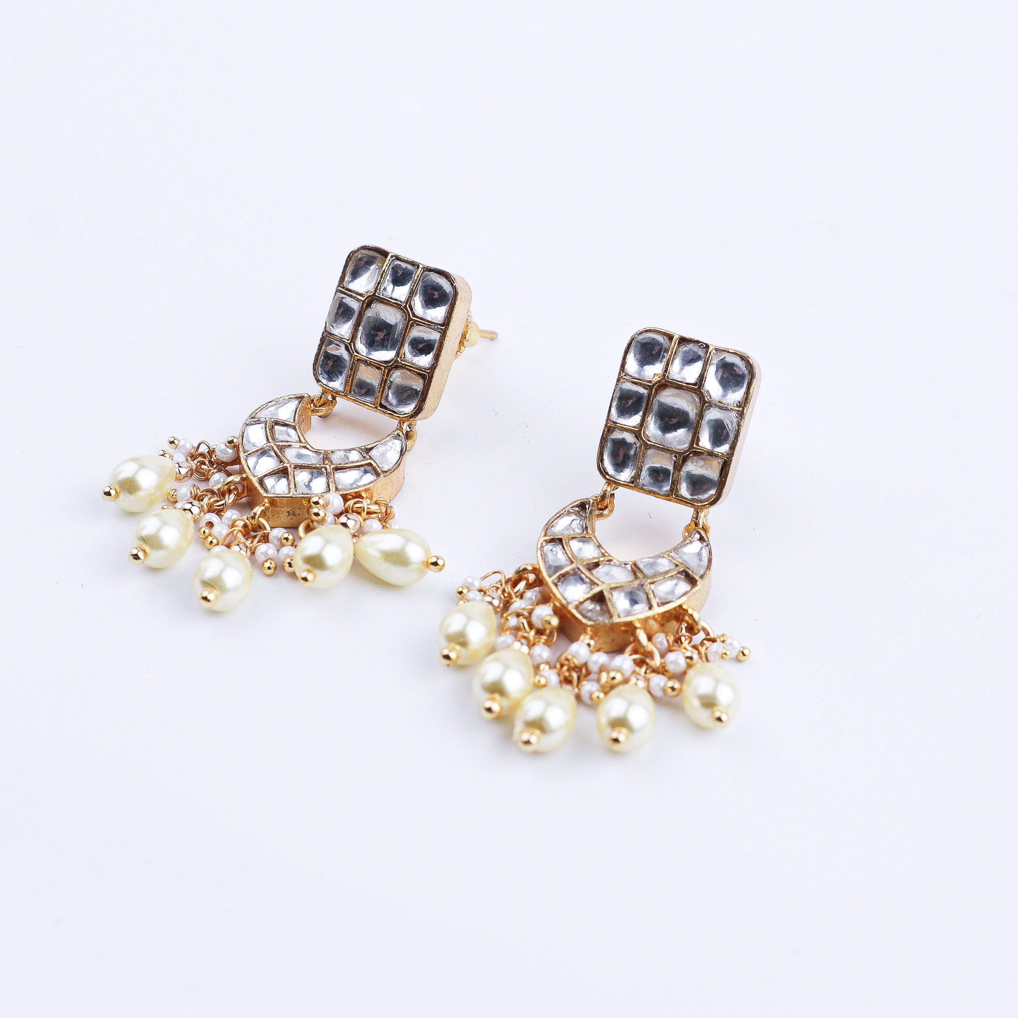 Angled view of a 22K gold-plated fashion earring highlighting its elegant silhouette, structure, and polished gold finish