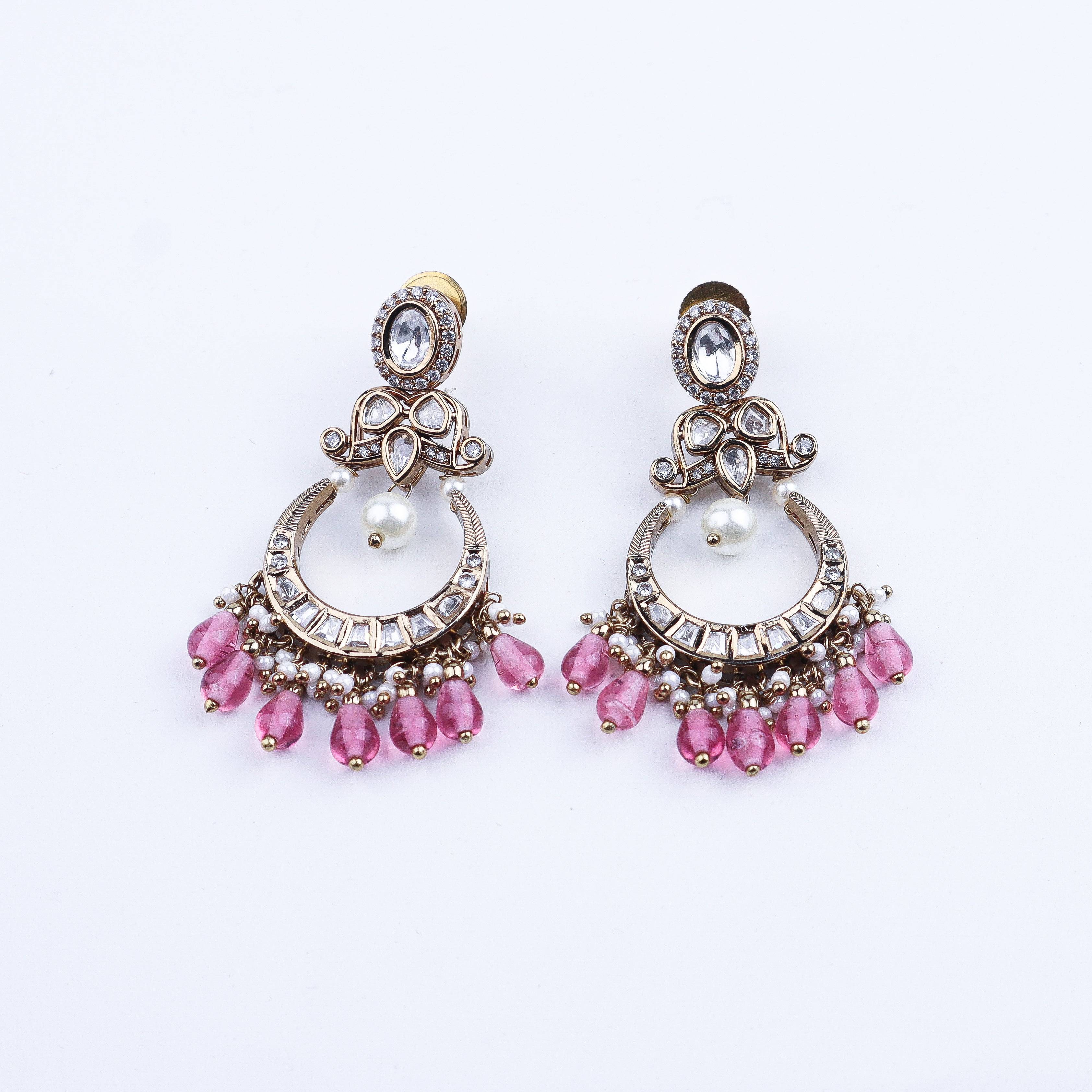 Angled view of a 22K gold-plated fashion earring highlighting its elegant silhouette, structure, and polished gold finish