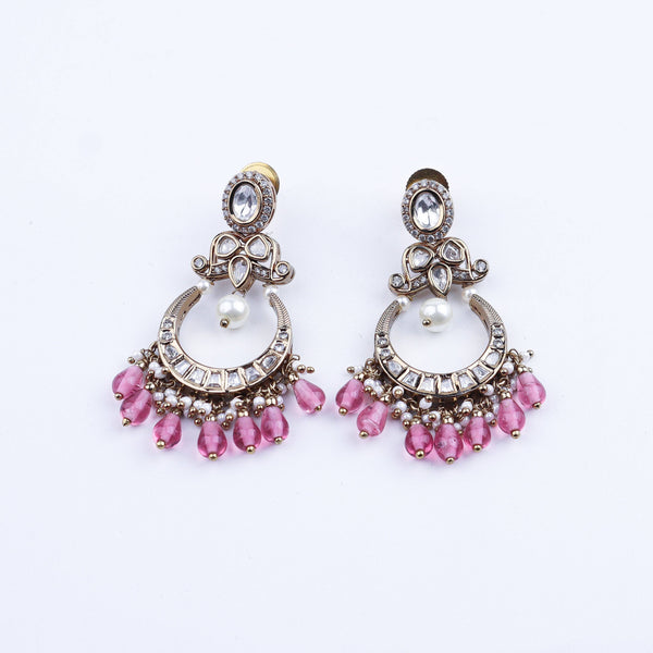 Angled view of a 22K gold-plated fashion earring highlighting its elegant silhouette, structure, and polished gold finish