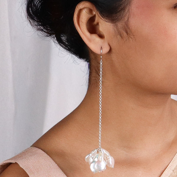 Model wearing Luxe Baroque Pearl Drop Earrings