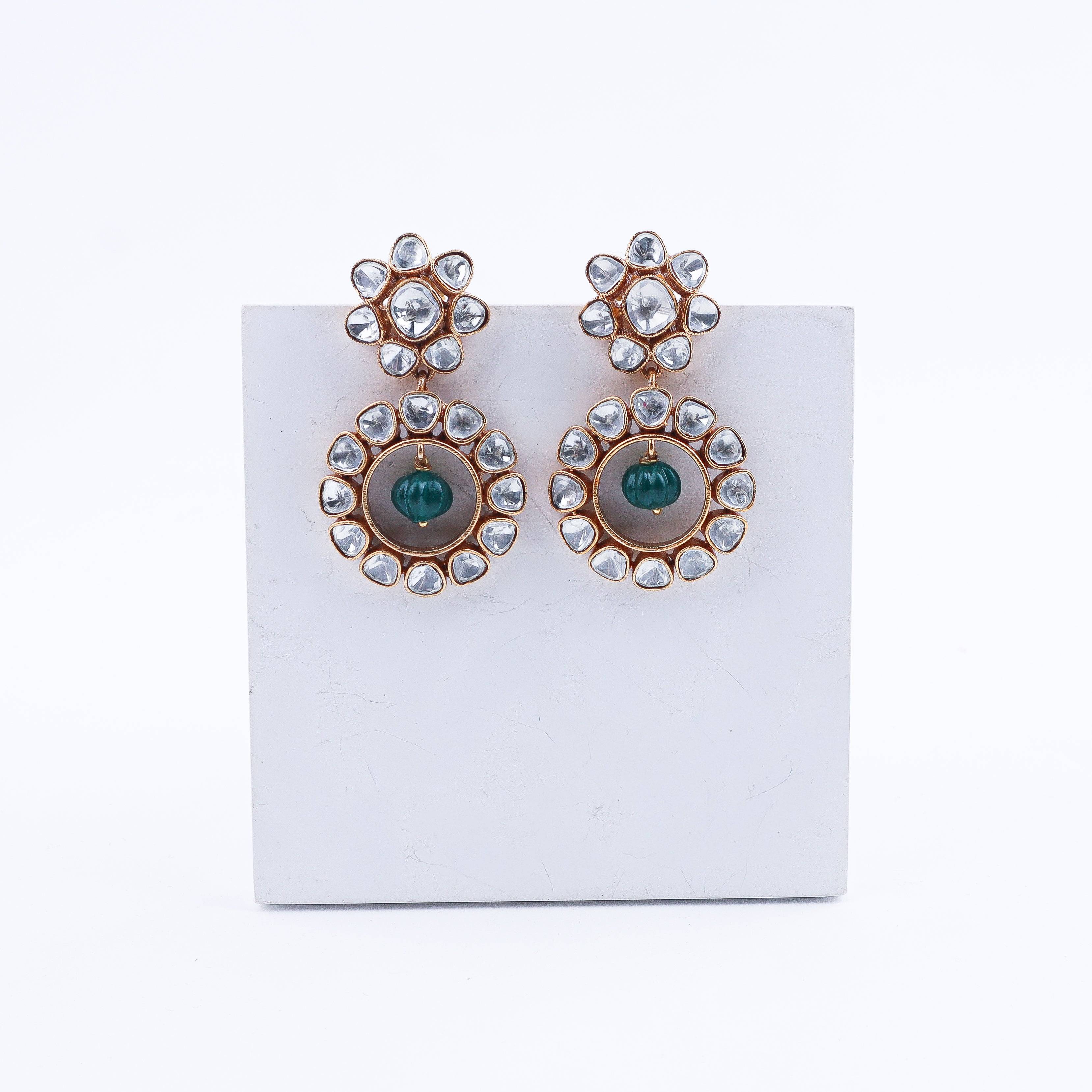 Angled view of a 22K gold-plated fashion earring highlighting its elegant silhouette, structure, and polished gold finish