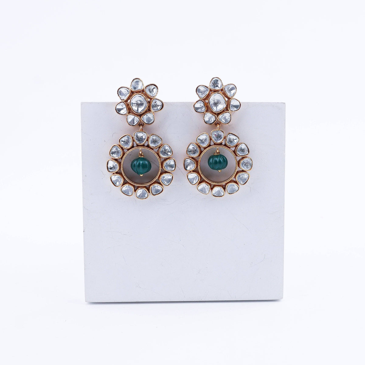 Angled view of a 22K gold-plated fashion earring highlighting its elegant silhouette, structure, and polished gold finish