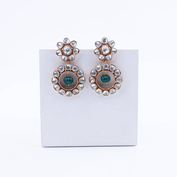 Angled view of a 22K gold-plated fashion earring highlighting its elegant silhouette, structure, and polished gold finish