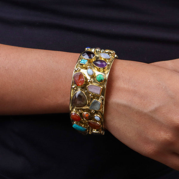 Model wearing a brass fashion bracelet for a stylish and contemporary fashion jewelry look