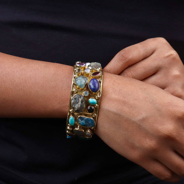 Model wearing a brass fashion bracelet for a stylish and contemporary fashion jewellery look