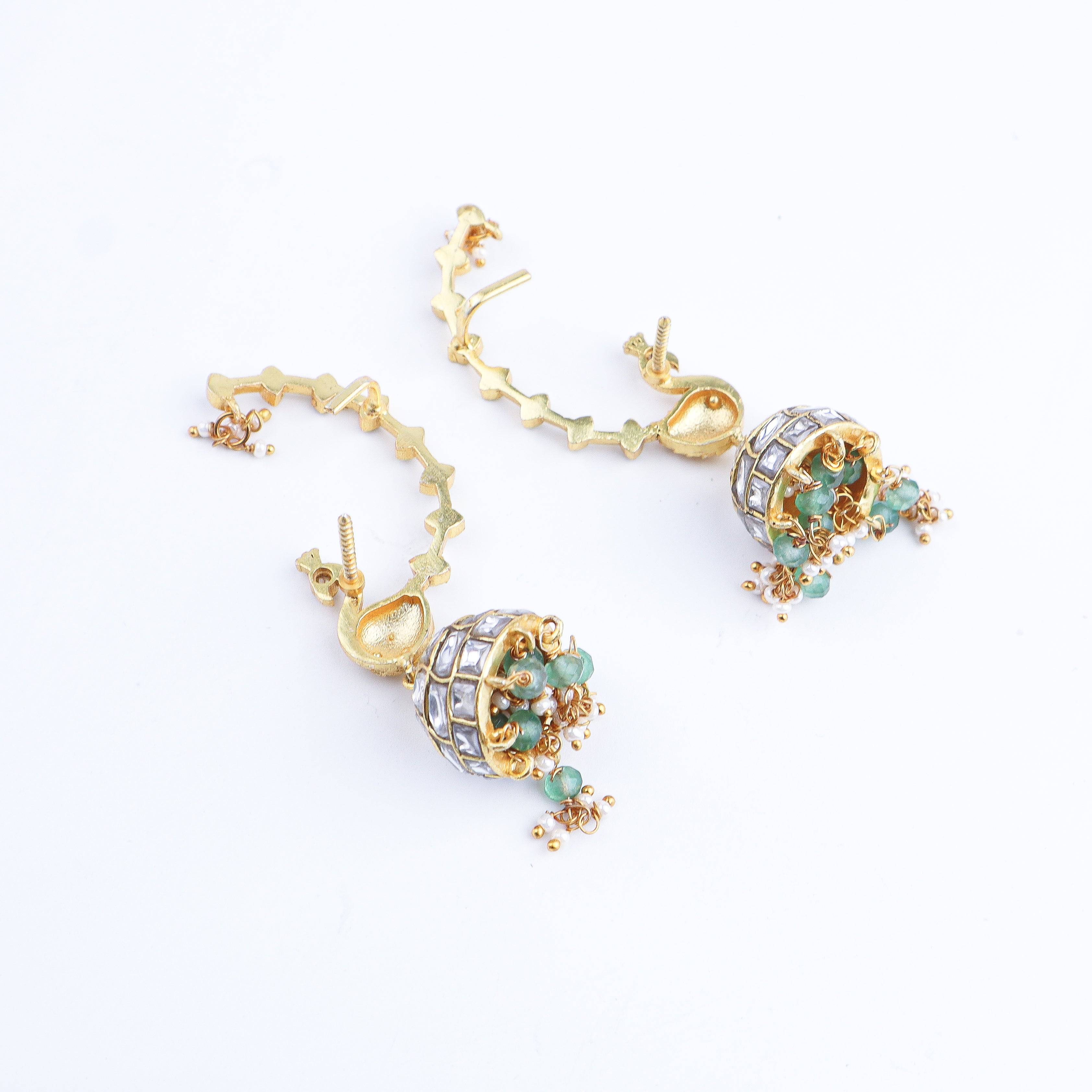 Angled view of a 22K gold-plated fashion earring highlighting its elegant structure, unique silhouette, and polished gold finish