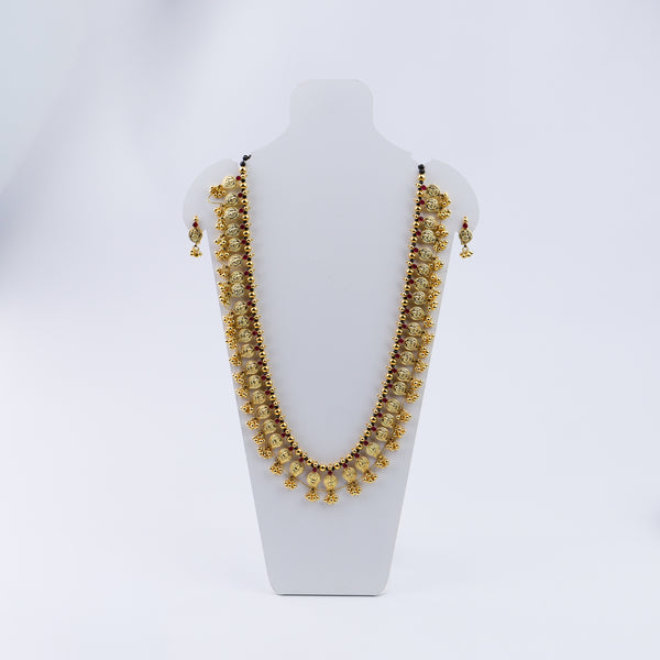 Gold coin pendant earrings with red accents