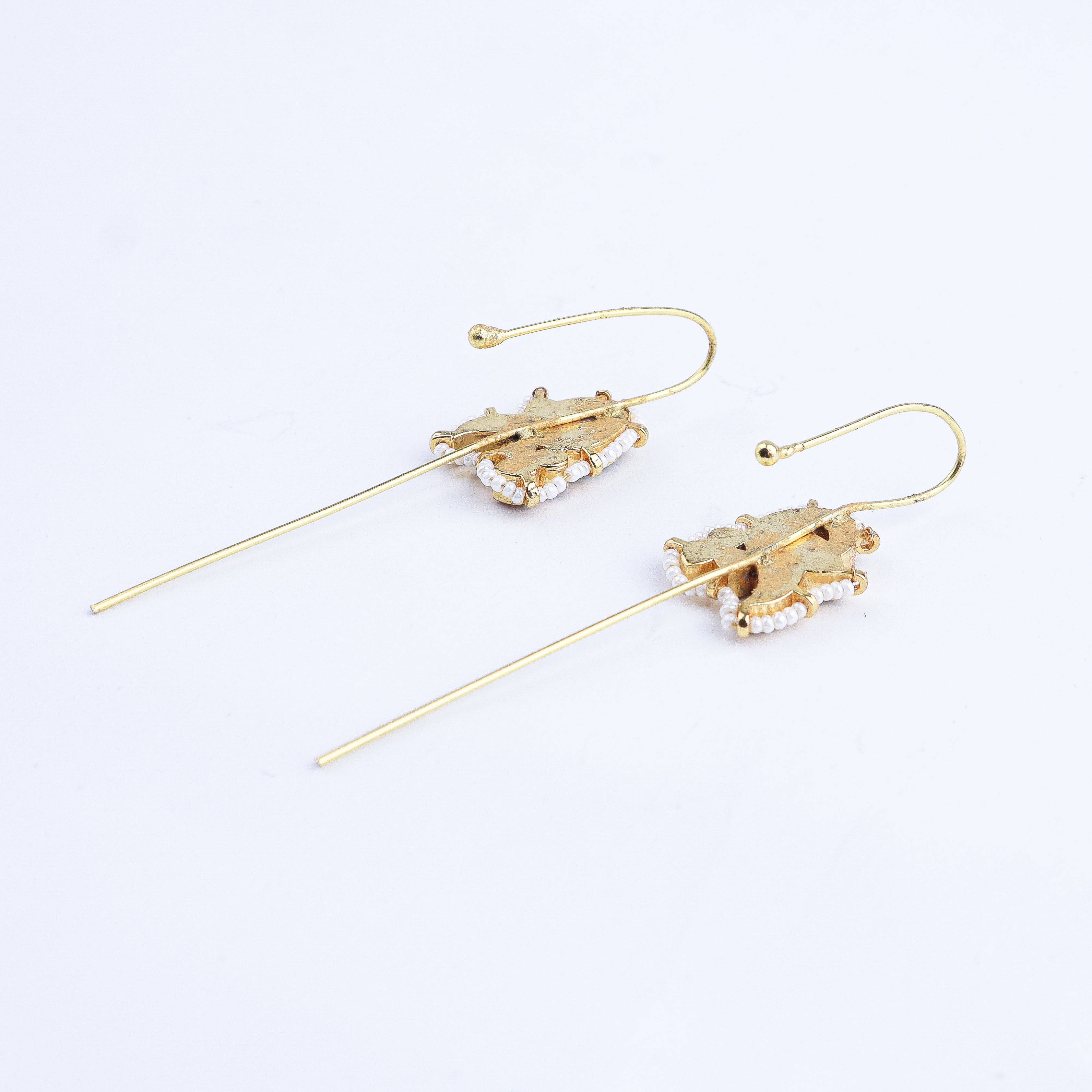 Angled view of a 22K gold-plated fashion earring highlighting its elegant structure, unique silhouette, and polished gold finish
