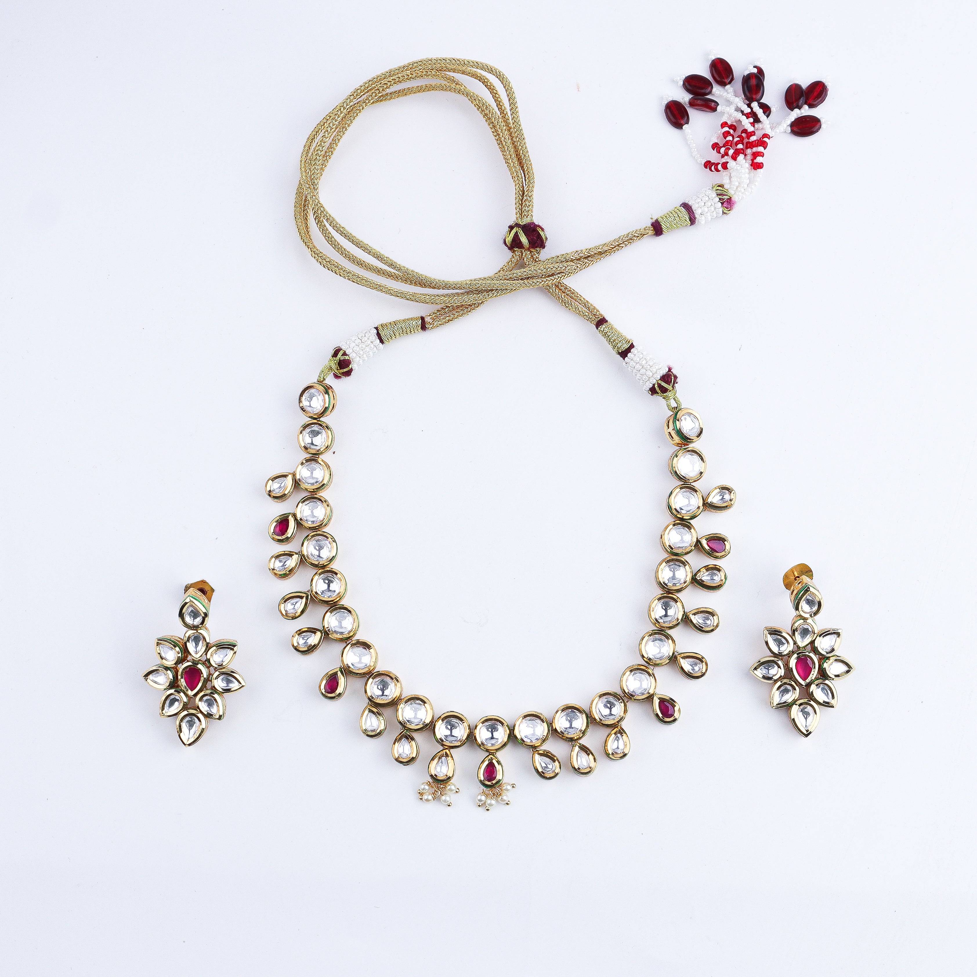 Detailed view of a 22K gold-plated fashion set highlighting intricate motifs, textured detailing, and a premium 22K gold-plated finish
