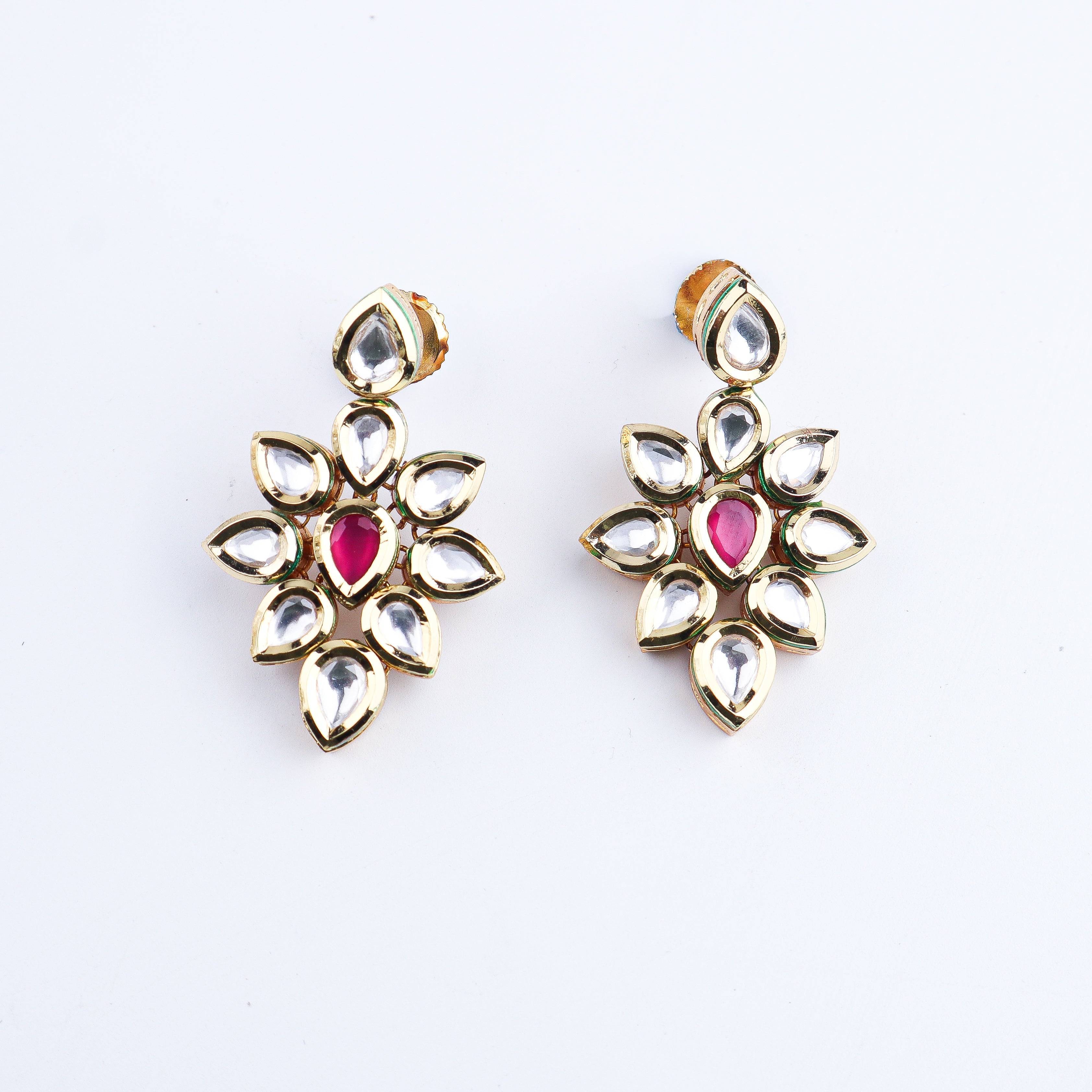 Angled view of a 22K gold-plated fashion set highlighting its coordinated design, elegant structure, and polished gold finish
