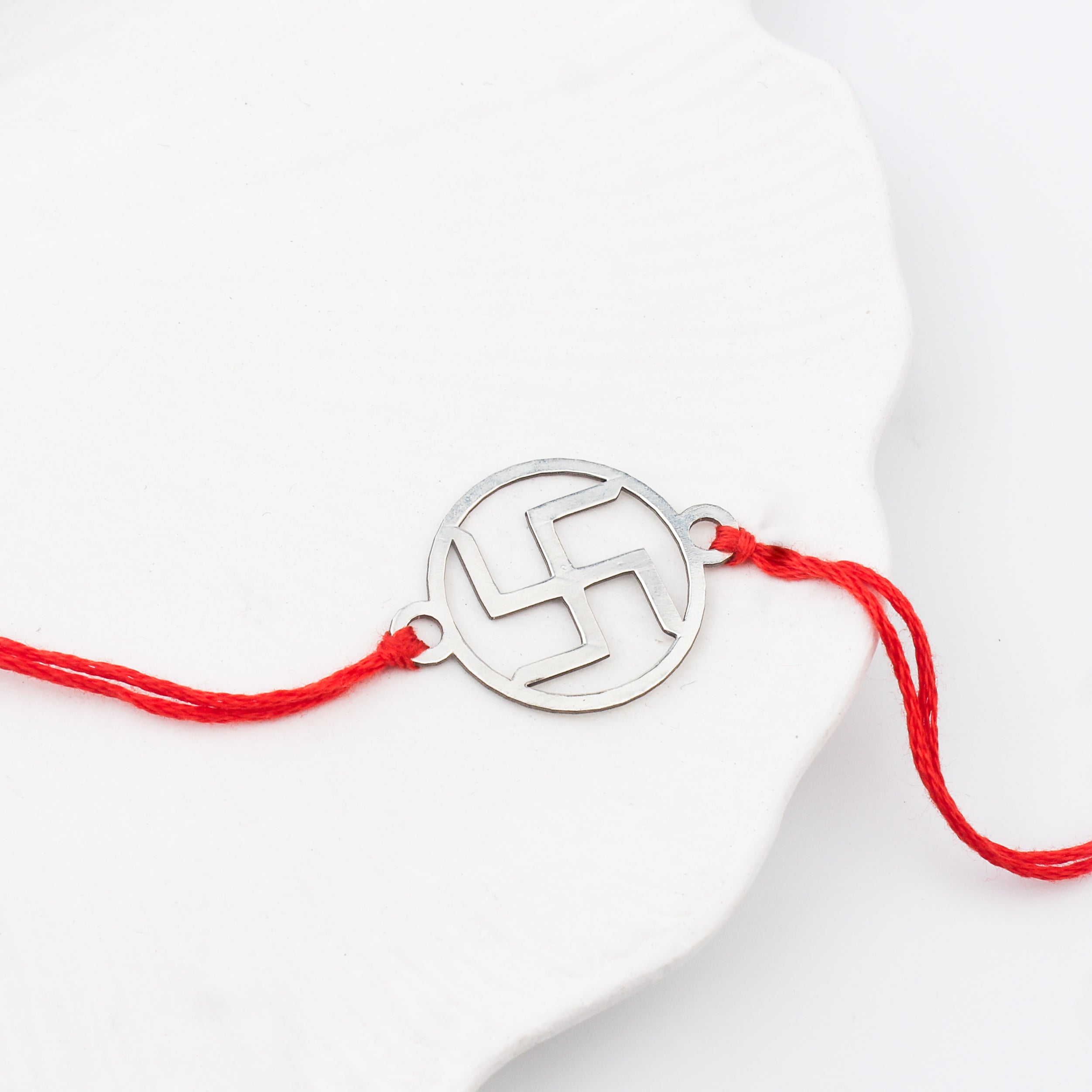 Silver Laser cut Swastik Rakhi: Small