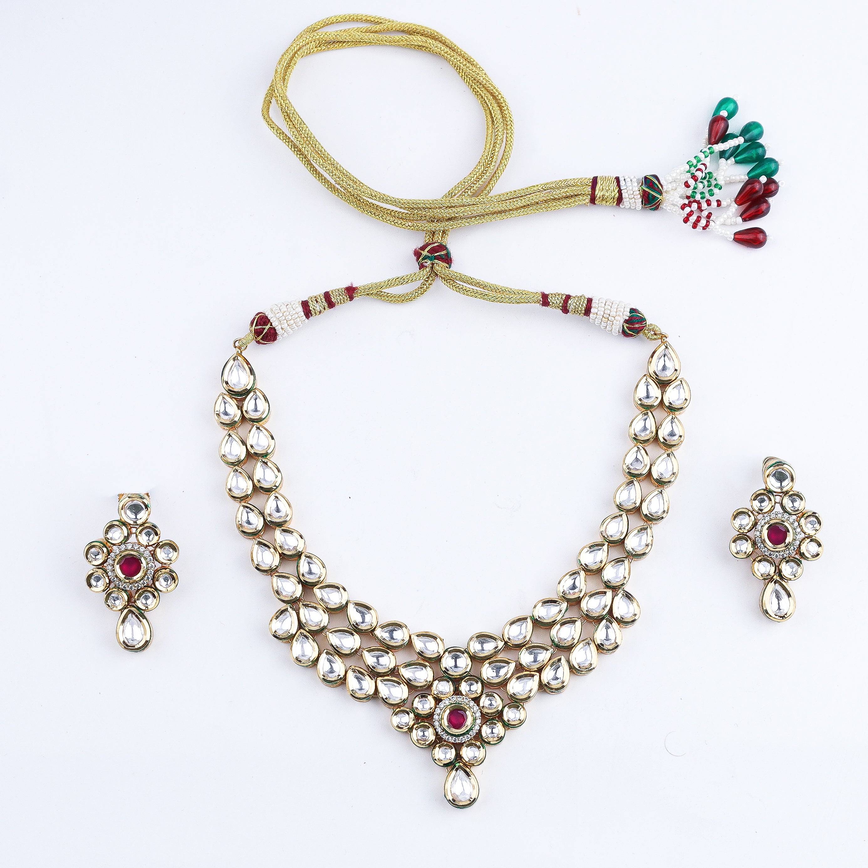 Detailed view of the 22K gold-plated fashion set highlighting intricate motifs, textured detailing, and premium 22K gold-plated finish