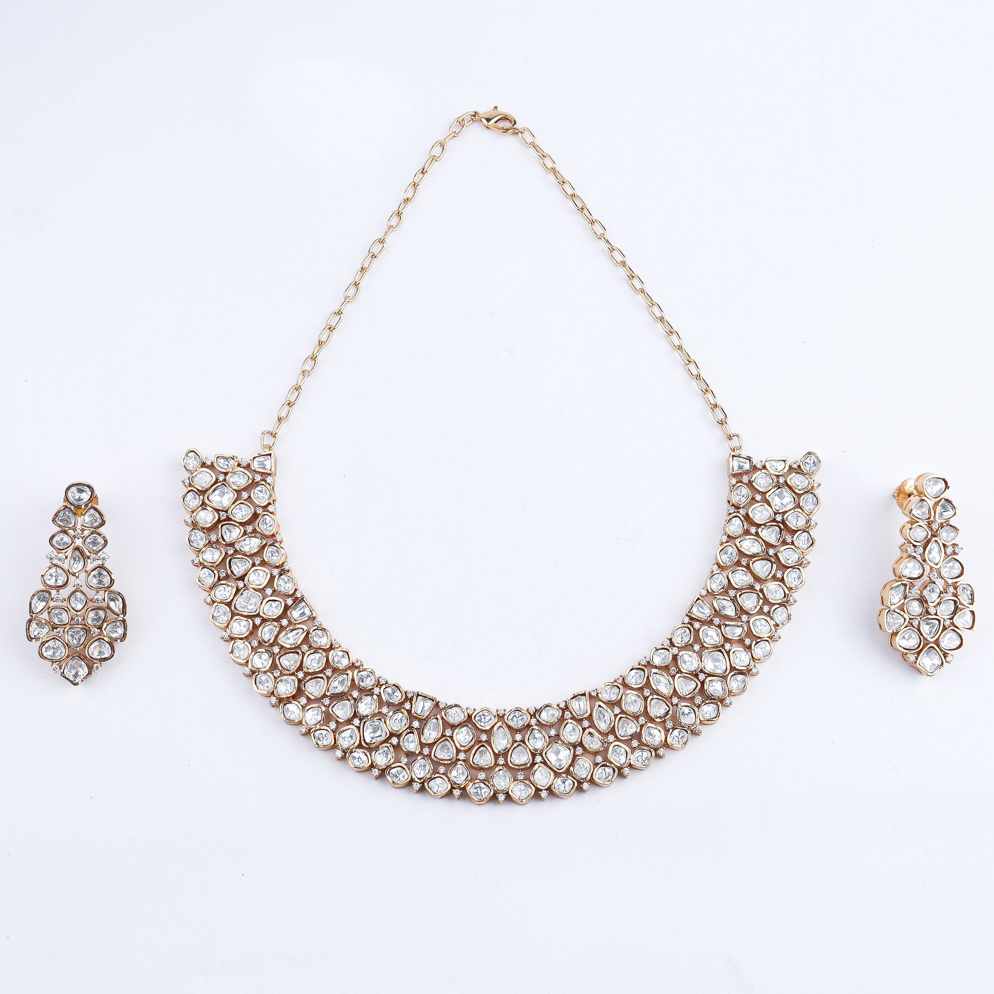 Detailed view of a 22K gold-plated fashion set highlighting intricate motifs, textured detailing, and a premium 22K gold-plated finish