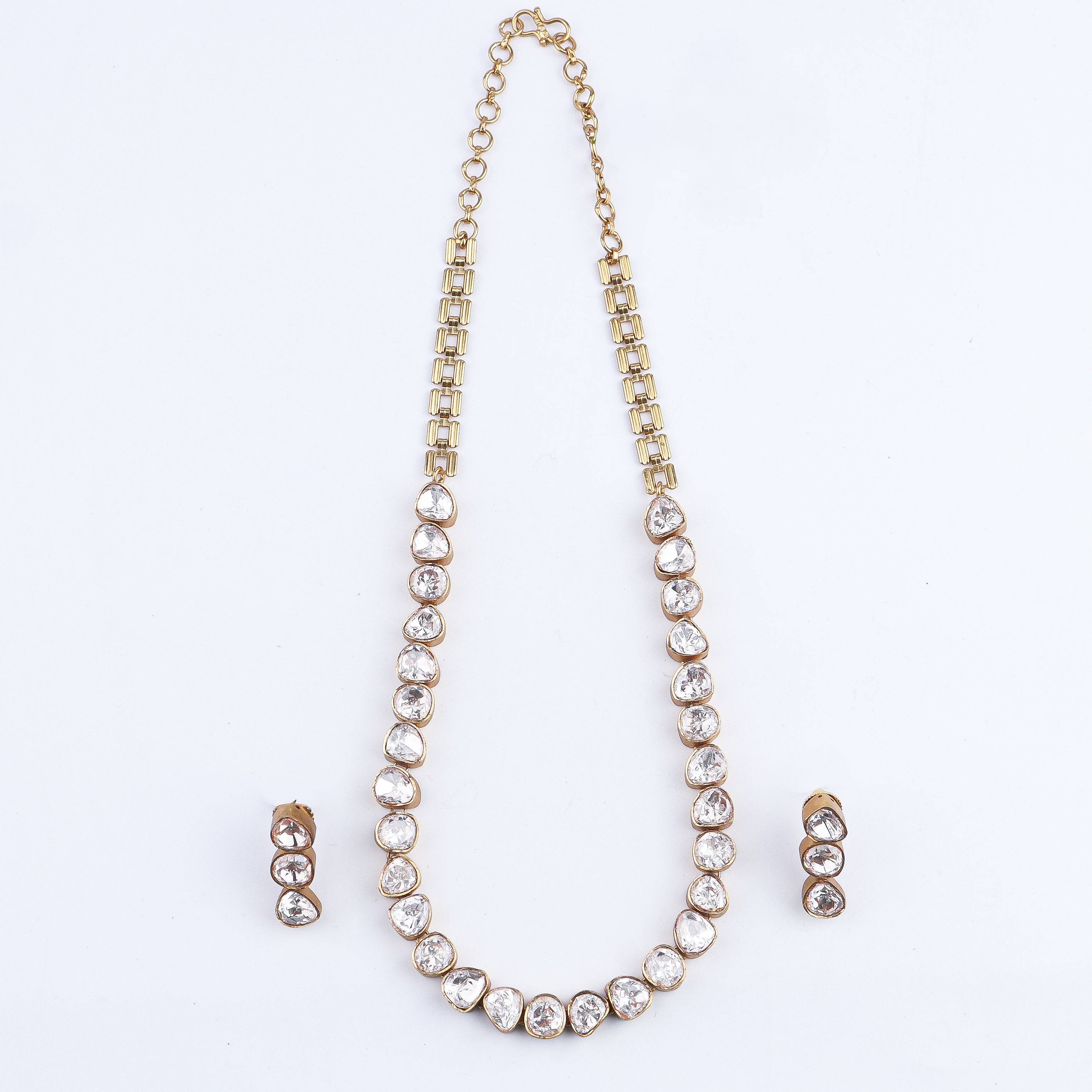 Detailed view of 22K gold-plated fashion set highlighting intricate motifs, textured detailing, and a premium 22K gold-plated finish