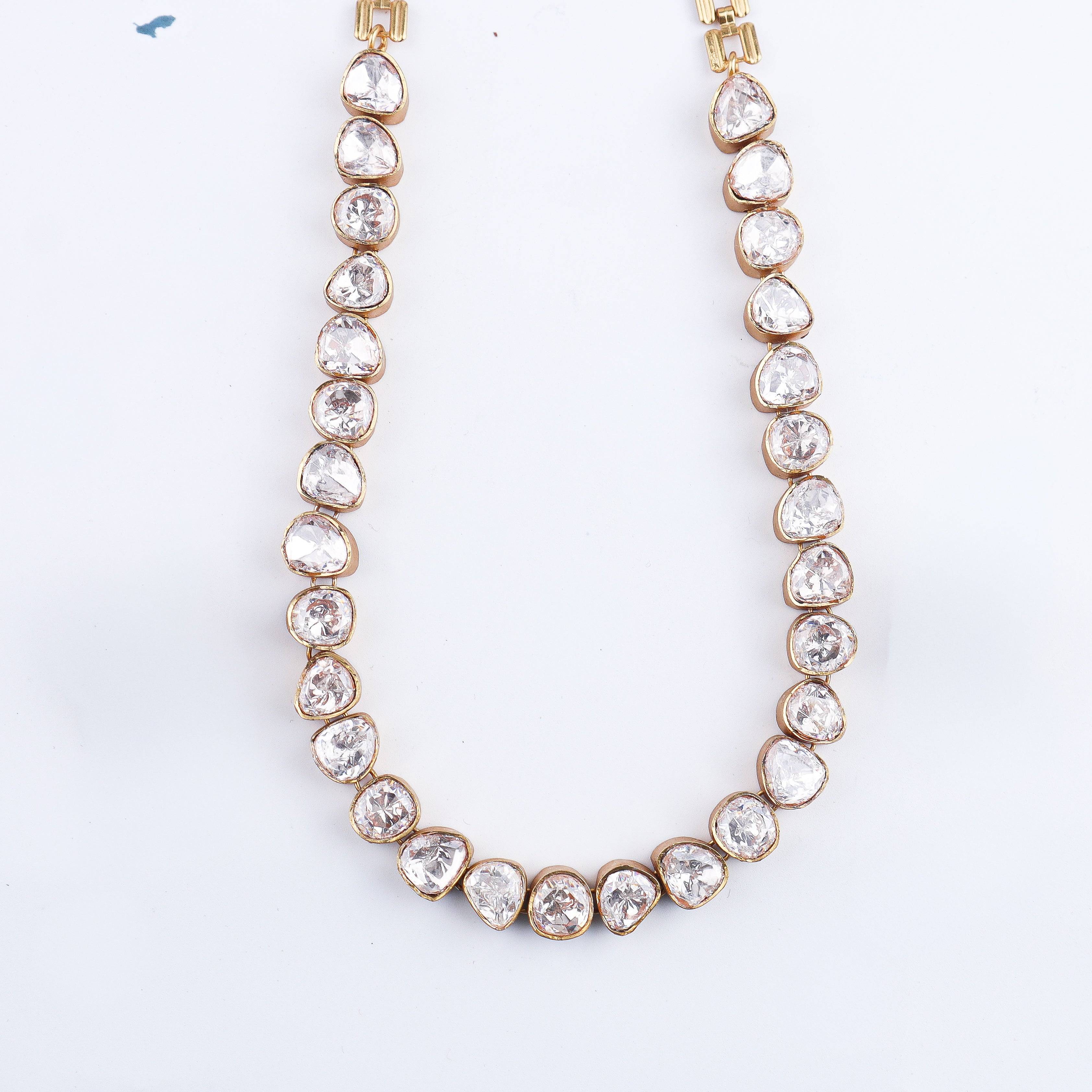 Flat-lay of 22K Gold-Plated Fashion Set with complementary gold-plated jewelry and elegant festive accessories