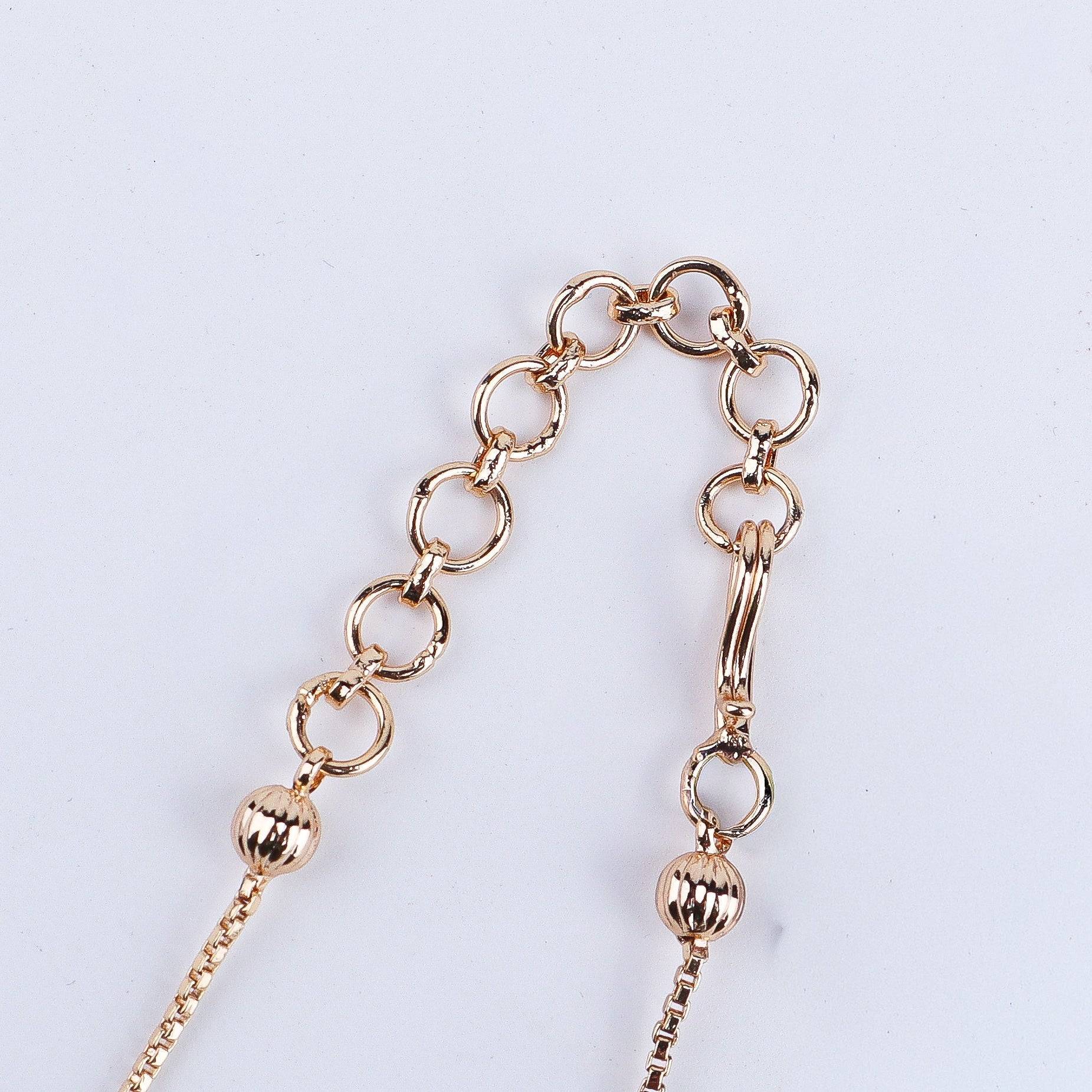 Angled view of the 22K gold-plated fashion set highlighting its coordinated design, elegant structure, and polished gold finish