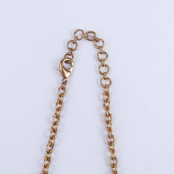 Angled view of the 22K gold-plated fashion set highlighting its coordinated design, elegant structure, and polished gold finish