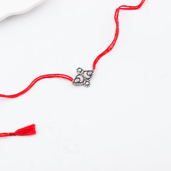 Handcrafted Silver Rakhi/Pendant: Chandrakor & Drop Motif