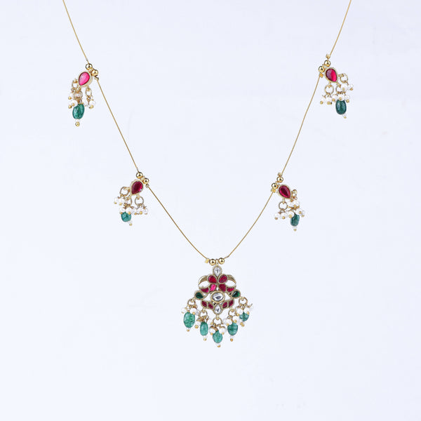 Flat-lay of 22K gold-plated fashion necklace with complementary gold-plated jewellery and elegant accessories