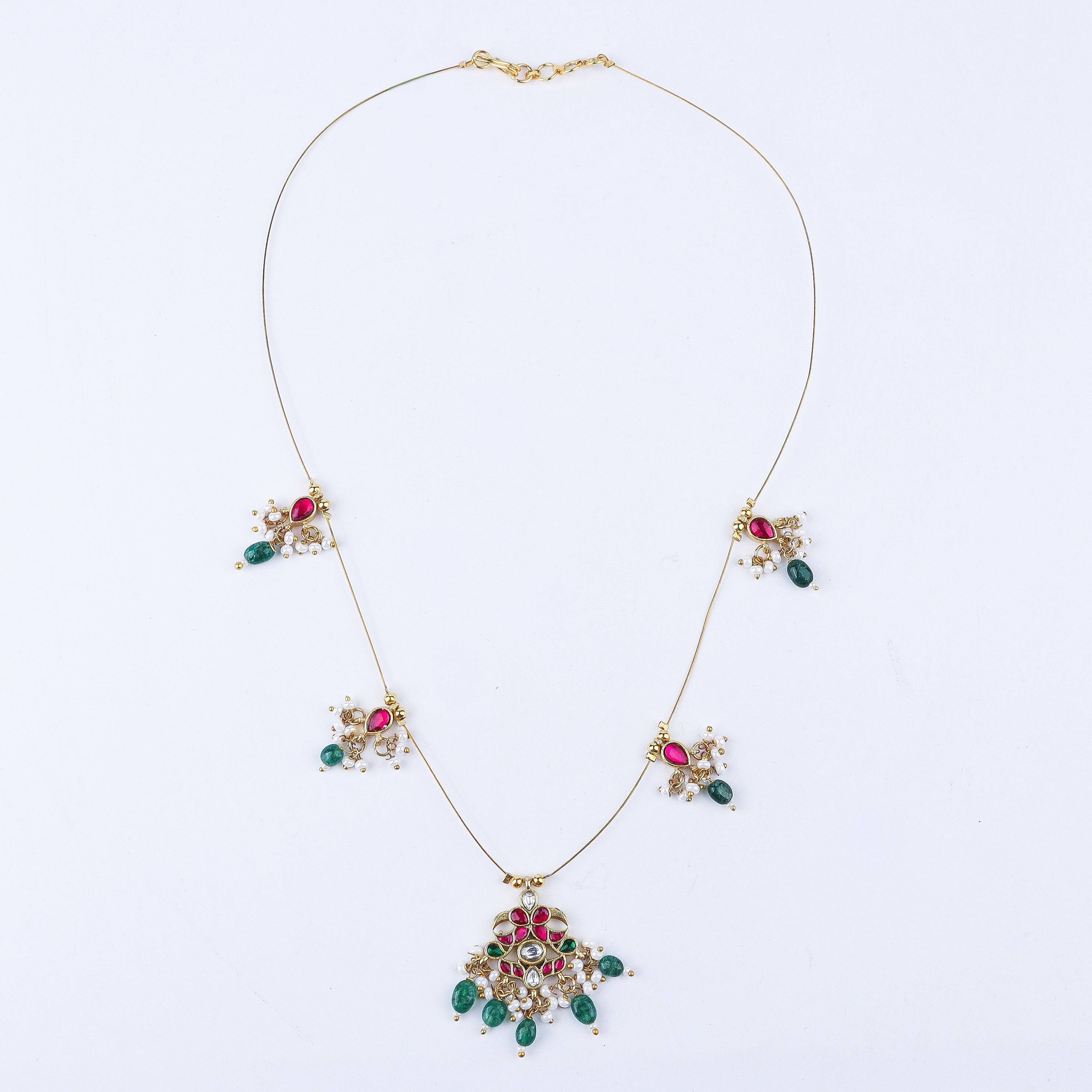 Detailed view of 22K gold-plated fashion necklace highlighting intricate motifs, textured detailing, and a premium 22K gold-plated finish