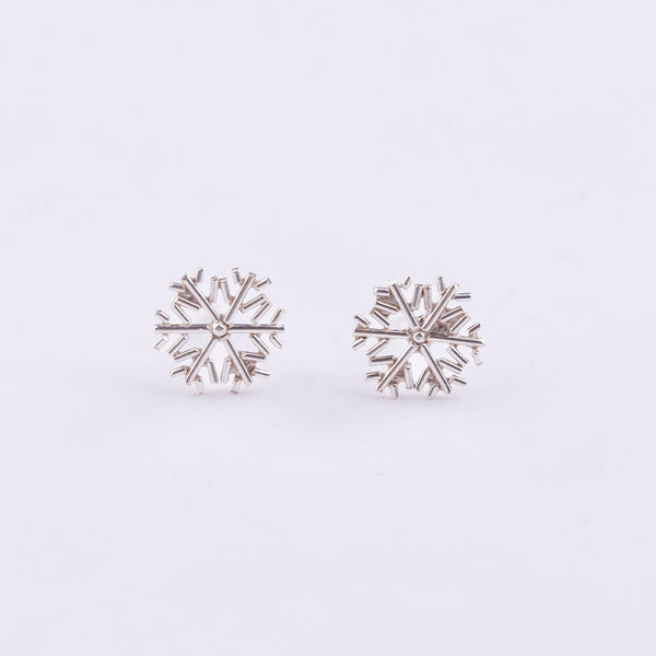 Silver snowflake earrings close-up