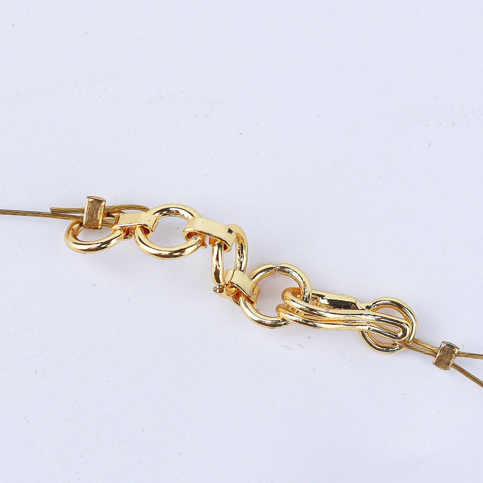 Angled view of a 22K gold-plated fashion necklace highlighting its elegant structure, unique design, and polished gold finish