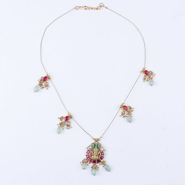 Detailed view of a 22K gold-plated fashion necklace highlighting intricate motifs, textured detailing, and a premium 22K gold-plated finish