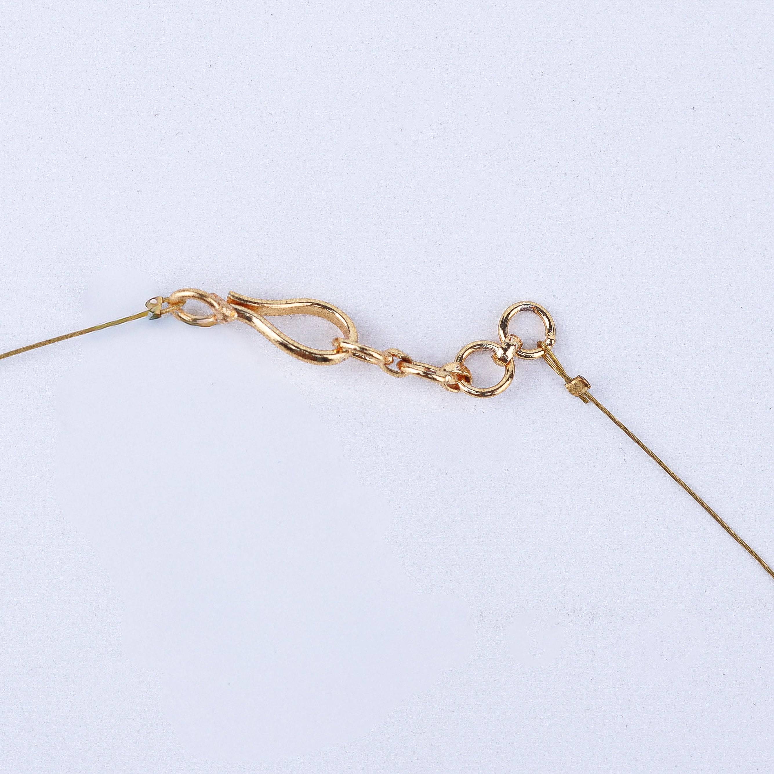Angled view of a 22K gold-plated fashion necklace highlighting its elegant structure, design, and polished gold finish