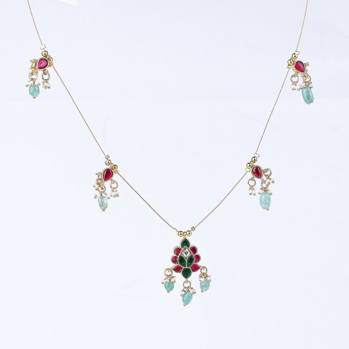 Detailed view of a 22K gold-plated fashion necklace highlighting intricate motifs, textured detailing, and a premium 22K gold-plated finish