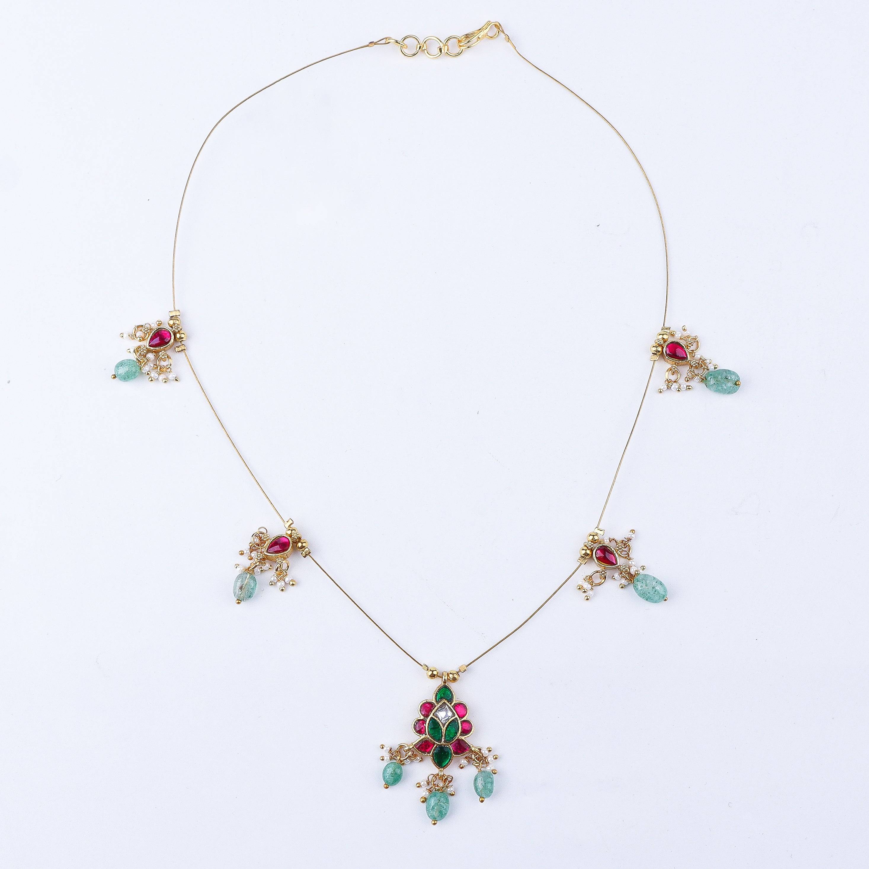 Detailed view of a 22K gold-plated fashion necklace highlighting intricate motifs, textured detailing, and premium 22K gold-plated finish