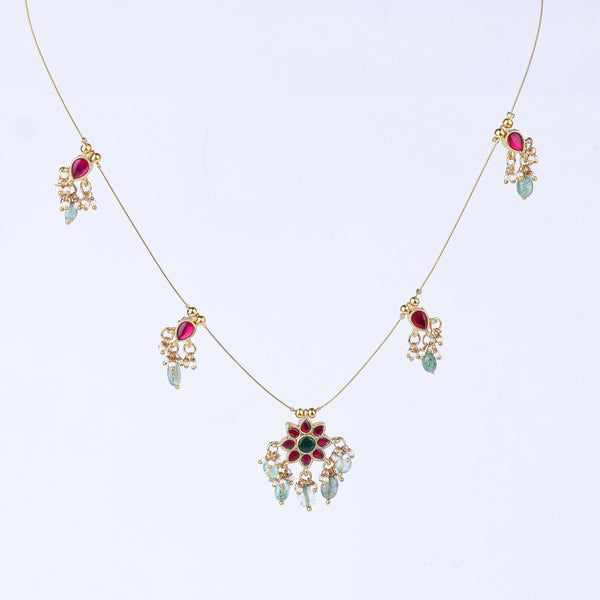 Close-up of a 22K gold-plated fashion necklace showcasing intricate detailing, fine craftsmanship, and rich 22K gold plating