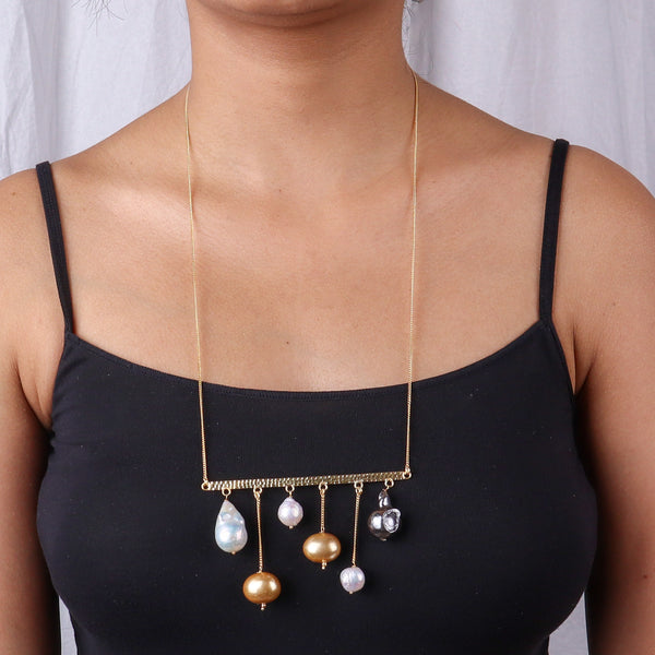 Gold necklace with pearl and bead accents