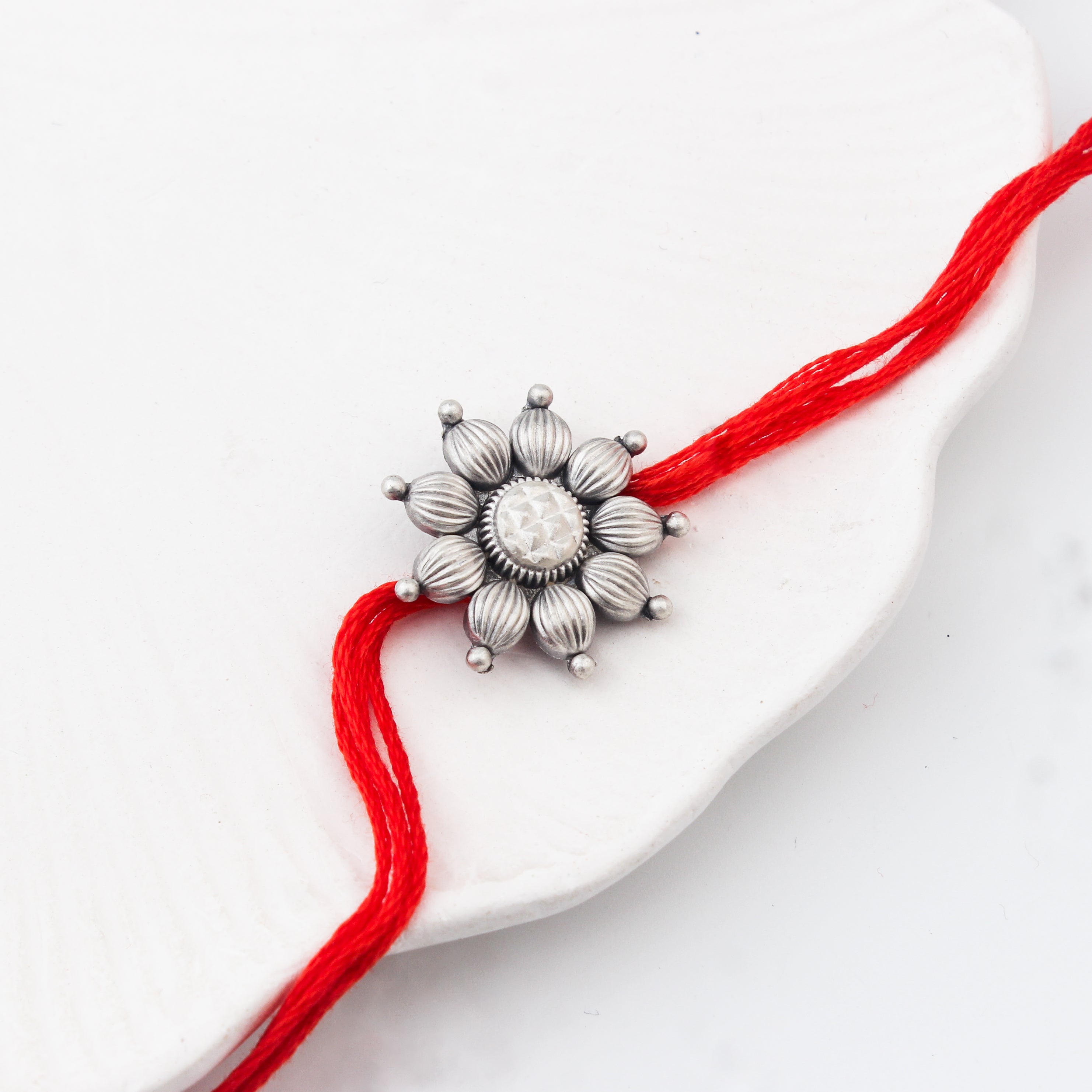 Handcrafted Silver Rakhi/Pendant: Big Flower