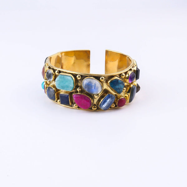 Close-up of a brass fashion bracelet showcasing intricate detailing, textured elements, and fine craftsmanship