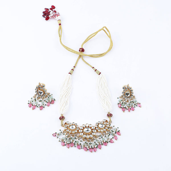 Detailed view of 22K gold-plated fashion set highlighting intricate motifs, textured detailing, and a premium 22K gold-plated finish